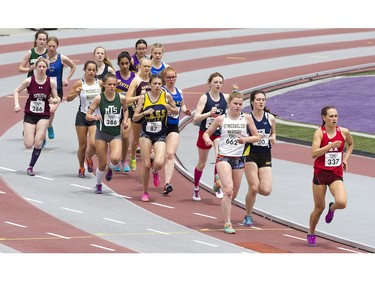 Junior girls run in the 3000m race during the WOSSAA track and field championship at TD Stadium in London on Friday. (Derek Ruttan/The London Free Press)