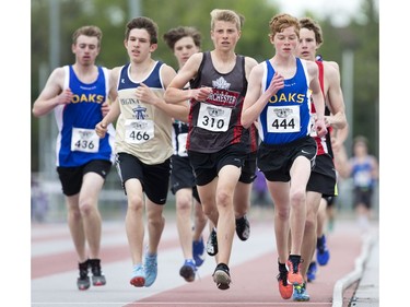 Junior boys run in the 3000m race during the WOSSAA track and field championship at TD Stadium in London on Friday. (Derek Ruttan/The London Free Press)