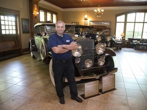 Steve Plunkett with two 1930 Cadillac series 452 luxury vehicles at his estate in London. (Derek Ruttan/The London Free Press)