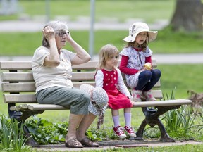 Ivanka Vuksinic  took her granddaughters Lina Vuksinic (3) and Klara Vuksinic (5) to Greenway Park. After some time on the playground they took a break on a park bench and watched the ducks. (Derek Ruttan/The London Free Press)