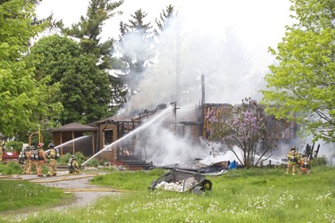 Fire destroyed a house at 6231 Colonel Talbot Road in London, Ont. on Thursday May 30, 2019. Derek Ruttan/The London Free Press/Postmedia Network