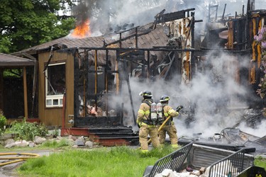 Fire destroyed a house at 6231 Colonel Talbot Rd. in London on Thursday. (Derek Ruttan/The London Free Press)