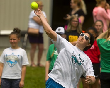 Kinsley McCallum, 13, of St. Sebastian throws for a gold medal distance in soft ball throw at the London District Catholic school board elementary track and field meet being held this week at TD Stadium in London on Friday. (Mike Hensen/The London Free Press)