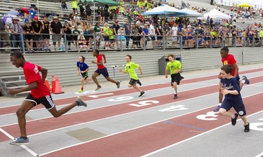 David Anukam, 11, of St. Thomas More wins his 50m sprint at the London District Catholic school board elementary track and field meet being held this week at TD Stadium in London on Friday. (Mike Hensen/The London Free Press)