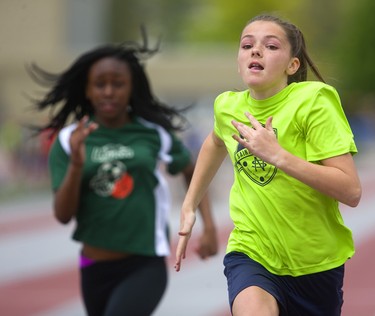 Heather McDougall of St. Nicholas wins her 50m sprint ahead of Evangeline Bongeli of Frere Andre at the London District Catholic school board elementary track and field meet being held this week at TD Stadium in London on Friday. (Mike Hensen/The London Free Press)
