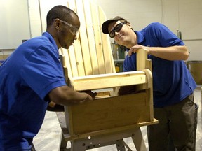 Alex Hiyabu left, and Jamie Gray build a Muskoka chair in the woodworking area at Youth Opportunities Unlimited on White Oaks Road on Tuesday January 18, 2011.  (Free Press file photo)