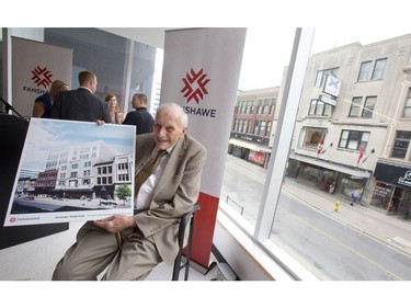 Fred Kingsmill holds an artist rendering that shows the transformation the Kingsmill's department store across the street will undergo to become the new home to 1,600 Fanshawe College students during a press conference at the College's Centre for Digital and Performance Arts on Dundas Street in London, Ontario on Thursday June 26, 2014.  The acquisition will see the College move 1,600 students to the downtown campus hub.   CRAIG GLOVER/The London Free Press/QMI Agency