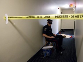 A London Police constable guards the scene outside of a third floor apartment at 1825 Whitney Street, where Suzan Jacob, 50, was stabbed to death. (File photo)