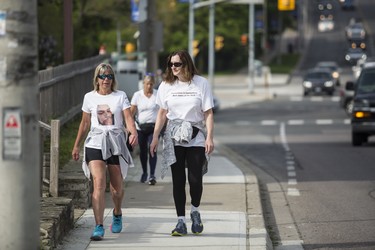 Toronto, ONT.: May 30, 2019 --  Lisa Hennessey, Rebecca McLean, and Lynn Pigeau walk along Dundas Street West near Islington Avenue as they near the end of their 184 km trek from London to Toronto to bring attention to deaths in correctional facilities (including those of their loved ones) and to inspire changes to corrections in Ontario. Toronto, Ont., May 30, 2019. (Nick Kozak for Postmedia News). ORG XMIT: POS1905301825330784