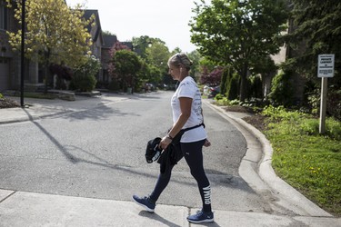 Toronto, ONT.: May 30, 2019 -- Lynn Pigeau walks along Dundas Street West near Islington Avenue on her 184 km walk from London to Toronto to bring changes to corrections. Toronto, Ont., May 30, 2019. (Nick Kozak for Postmedia News). ORG XMIT: POS1905301825350786