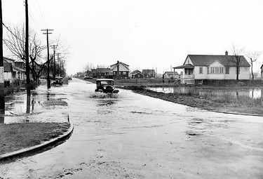 HISTORIC-April 5/1947-Motorist churning his way through flood water pouring onto the highway at Lauzon rd. and Clairview Ave, in Riverside. A section of Highway#2 were reported blocked by water earlier today. The rainfall was expected to continue. (The Windsor Star-FILE) Used online