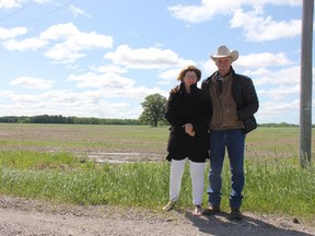 Gail and Fred Cahill, owners of the Texas Longhorn Ranch in Adelaide Metcalfe, stand next to a piece of land that could be turned into a storage facility for bio-fertilizers, fertilizers made mainly from human feces. The proposed project has drawn strong opposition from area residents. JONATHAN JUHA/THE LONDON FREE PRESS