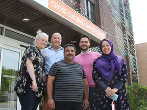 Cross Cultural Learner Centres Jennifer Sandu, Jan Jasnos, Yousef al Kurdi, Michele Manocchi and Hanaa Elkolaly stand outside their Dundas Street office. The local non-profit is organizing its annual talk on immigration, which this year will focus on myths and misconceptions about refugees. JONATHAN JUHA/THE LONDON FREE PRESS