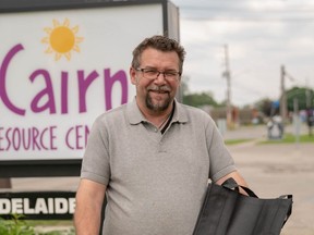 Stanislav Rajic, program manager at Glen Cairn Community Resource Centre, holds what Londoners can expect to receive in a Good Food Box. (Max Martin, London Free Press)