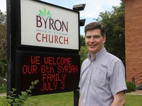 Byron United Church pastor Greg Brawn stands outside the west London church, which is getting ready to welcome this week their sixth Syrian family. (JONATHAN JUHA, The London Free Press)