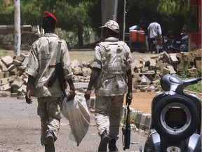 Members of Sudan's paramilitary Rapid Support Forces patrol Nile street in the capital Khartoum on June 10, 2019 on the second day of a nationwide civil disobedience campaign called to pressure the ruling military into handing over power. - A nationwide civil disobedience campaign by Sudanese protesters entered a second day today, as the authorities released three prominent rebels detained after a crackdown that left dozens dead. Some shops opened and buses plied the streets of Khartoum, but much of the capital remained shut.