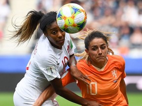 Canada's defender Ashley Lawrence (L) vies with Netherlands' midfielder Danielle van de Donk during the France 2019 Women's World Cup Group E football match between the Netherlands and Canada, on June 20, 2019, at the Auguste-Delaune Stadium in Reims, eastern France.