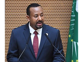 In this file photo taken on November 17, 2018 Ethiopia's Prime Minister Abiy Ahmed delivers a speech during the 11th Extraordinary Session of the Assembly of the African Union in Addis Ababa, Ethiopia.