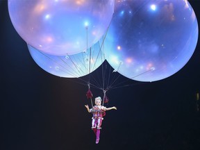 The Clowness from Cirque du Soleil's Corteo floats above the stage on April 26, 2019, during the show's stop at the Chaifetz Arena in St. Louis, Mo.