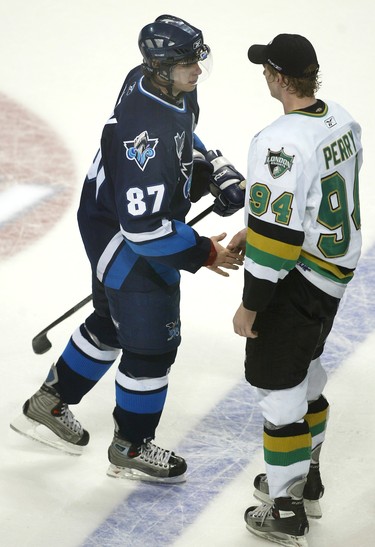 London Knights player Corey Perry (RIGHT) shakes hands with  Rimouski Oceanic star Sidney Crosby after the Knights won 4-0 to win the Cup Sunday evening at London's John Labatt Centre.  For stories by Aaron Wheery, Joe O'Connor and Cam Cole/National Post Staff photo by Peter J. Thompson/National Post