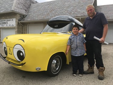 David Dewolfe and his son Jimmy, 5, came to the final Fleetwood Country Cruize-In for a chance to see Steve Plunkett's 50 Cadillacs. They also took a look at Mr. Beep, a car built on the chassis of a 1959 Ford Zephyr convertible by the British Petroleum Oil Company. (MEGAN STACEY/The London Free Press)