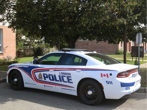 London police remain at the scene of a shooting in a Wavell Street townhouse complex just south of Dundas Street  on Wednesday, August 30, 2017.  (Mike Hensen/The London Free Press)