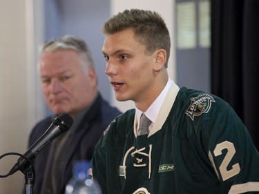 Alec Regula speaks at a press conference to announce his signing with the London Knights at Budweiser Gardens in London, Ont. on Friday September 8, 2017. Beside him is the team's president, owner and head coach Dale Hunter. (Derek Ruttan/The London Free Press)