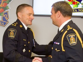 London police chief designate Steve Williams is congratulated by current London Police chief John Pare during the announcement of Williams promotion. Photograph taken on Wednesday June 5, 2019. (Mike Hensen/The London Free Press)