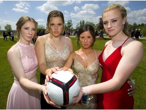 Madison Wright, 17, Kristen Bisschop, 18, Hannah Vickers, 18 and Victoria Quance, 18 are all graduating students from Lord Dorchester secondary school and are on the school's OFSAA-bound girls soccer team. And there's the rub. Thursday is prom night for Lord Dorchester and also the night of the OFSAA pre-tournament dinner in Hamilton, and they've been told they cannot play with their team in the OFSAA tournament, if they don't attend the dinner.  (Mike Hensen/The London Free Press)