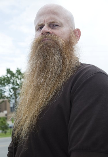 Jim Mahon is a personal support worker at LHSC in London, Ont. on Tuesday June 18, 2019. His employer has told him to shave his beard for a mandatory breathing mask test. He does not want to shave. Derek Ruttan/The London Free Press/Postmedia Network