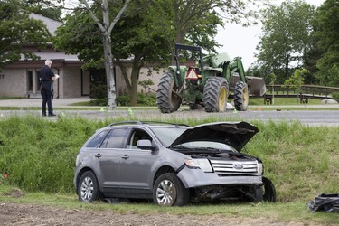 The driver of this tractor was taken to hospital with life threatening injuries after being in a collision with a car on Elginfield Road just east of Adelaide Street on Tuesday June 18, 2019. Derek Ruttan/The London Free Press/Postmedia Network