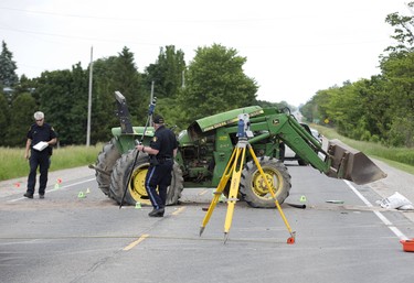 The driver of this tractor was taken to hospital with life threatening injuries after being in a collision with a car on Elginfield Road just east of Adelaide Street on Tuesday June 18, 2019. Derek Ruttan/The London Free Press/Postmedia Network