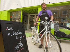 Ben Cowie, owner of the London Bicycle Cafe, shows off one of the bikes he is using for a bike-share pilot project he is starting June 22 in London.  Mike Hensen/The London Free Press
