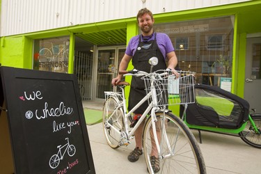 Ben Cowie, owner of the London Bicycle Cafe, shows off one of the bikes he is using for a bike-share pilot project he is starting June 22 in London.  Mike Hensen/The London Free Press