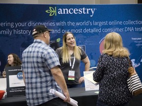 Joanna Buit of a genealogy tracking company called Ancestry speaks with Chris and Tammy Richard (cct) during Ontario Ancestors 2019 Conference and Family History Show at the London Convention Centre in London. The Richards travelled from Amherstburg to attend the event  where Chris discovered that he is descended from United Empire Loyalists. (Derek Ruttan/The London Free Press)