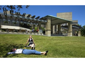 Mackenzy Metcalf, of Windsor, and Elizabeth MacDonald, of Meaford, both relax in the sunshine at Western University on Thursday, June 27, 2019.  Metcalf, a history student, knew about a popular professor, Geoffrey Stewart, whose contract wasn't being renewed by the university so Metcalf took his course this year rather than waiting for her fourth year. Metcalf said, "Three major history professors who were very popular weren't renewed. We started a petition and told the university how much the professors were valued, but it didn't matter." (Mike Hensen/The London Free Press)