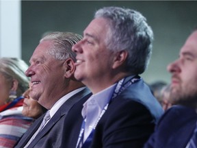 Ontario Premier Doug Ford and Dean French, his former chief of staff, centre. They appointed unqualified people to envoy positions, and Ford ended up rescinding those appointments.