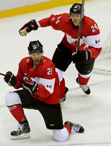Team Canada's Jamie Benn (#22) and Corey Perry (#24) celebrate Benn's second period goal during the men's ice hockey semifinal playoff game at the Bolshoy Ice Dome during the Sochi 2014 Winter Olympics in Sochi, Russia, on Friday Feb. 21, 2014. Al Charest/Calgary Sun