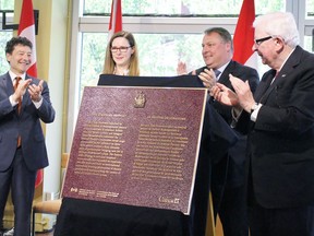 Stratford Festival artistic director Antoni Cimolino, left, executive director Anita Gaffney, Stratford Mayor Dan Mathieson, and Richard Alway, chair of the Historic Sites and Monuments Board of Canada, applaud the unveiling of a plaque designating the Festival a national historic event during a ceremony inside the Festival Theatre's lobby on Tuesday June 11, 2019 in Stratford, Ont. (Terry Bridge/Postmedia Network)