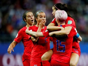 Alex Morgan of the U.S. celebrates scoring their 12th goal with Megan Rapinoe and teammates  (REUTERS/Christian Hartmann)