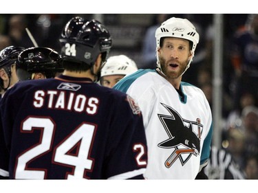 Edmonton Oilers' Steve Staios and San Jose Sharks' Joe Thornton chat during first period NHL action at Rexall Place in Edmonton, May 12, 2005.