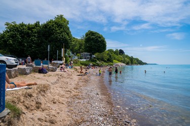 Bayfield's main beach has shrunk significantly because of rising waters on Lake Huron, as shown in this photo taken on Canada Day. Armour stones were moved up closer to the parking lot to make more room for beachgoers. (Max Martin, The London Free Press)