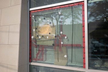 The London Public Library Crouch branch has three different smashed windows awaiting repairs. (Max Martin/London Free Press)