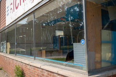 An unoccupied building on Hamilton Road has been vandalized with broken windows and graffiti in this photo taken July 5. (Max Martin/London Free Press)