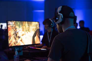 A Warframe player tests his skills at one of many gaming stations set up around TennoCon TennoCon, an annual convention of gamers hosted by Warframe developer Digital Extremes at London's convention centre, RBC Place. (MAX MARTIN, The London Free Press)