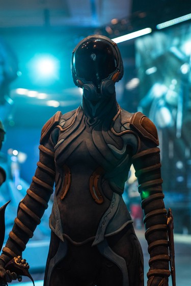 A costume of a Warframe character by Henchmen Studios, a special-effects shop in Toronto, is modelled at TennoCon Saturday. The outfit took a team of eight people more than three weeks to make. More than 2,000 people attend TennoCon, an annual convention at London's convention centre, RBC Place, Saturday which celebrates Warframe, a video game developed by London company Digital Extremes.  (MAX MARTIN, The London Free Press)