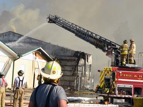 Perth East and Stratford firefighters responded to a structure fire involving the former Antique Warehouse building in Stratford Sunday afternoon. (Galen Simmons/Postmedia Network)