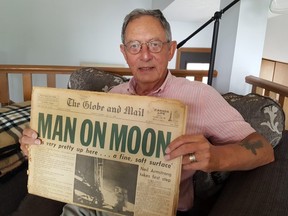 Richard Leah, of Chatham, shows off a newspaper for the moon landing, which is marking its 50th anniversary Saturday. (Trevor Terfloth/The Daily News)