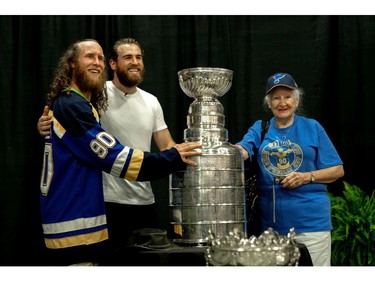 Janson Broome and Molly Broome snap a photo with St. Louis Blues star Ryan O'Reilly. (MAX MARTIN, The London Free Press)