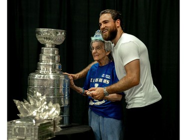 Ryan O'Reilly and his grandmother, Deirdre, pose for a photo with the Stanley Cup. (MAX MARTIN, The London Free Press)